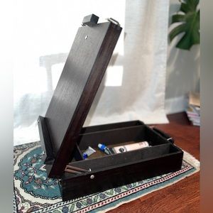 Wooden, portable artist’s easel, for on-the-go painting with easy storage.
